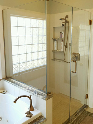 Frameless glass shower door on tile