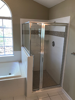 Glass shower door with modern fixtures