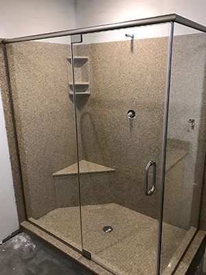 Clear glass shower enclosure in a coastal bathroom