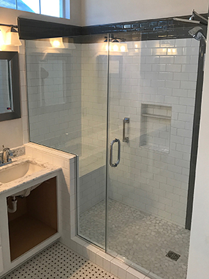 Glass shower door in a remodeled bath